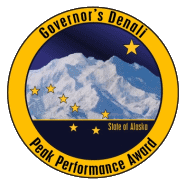 Peak Performance Award Logo, Denali overlaid by the Big Dipper and North Star, ringed in gold