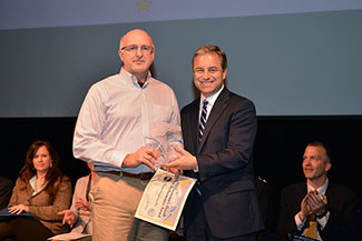 Photo of Thomas Dougherty receiving Leadership award