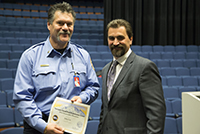 Photo of Sgt. John Cox receiving Co-Worker Honorable Mention